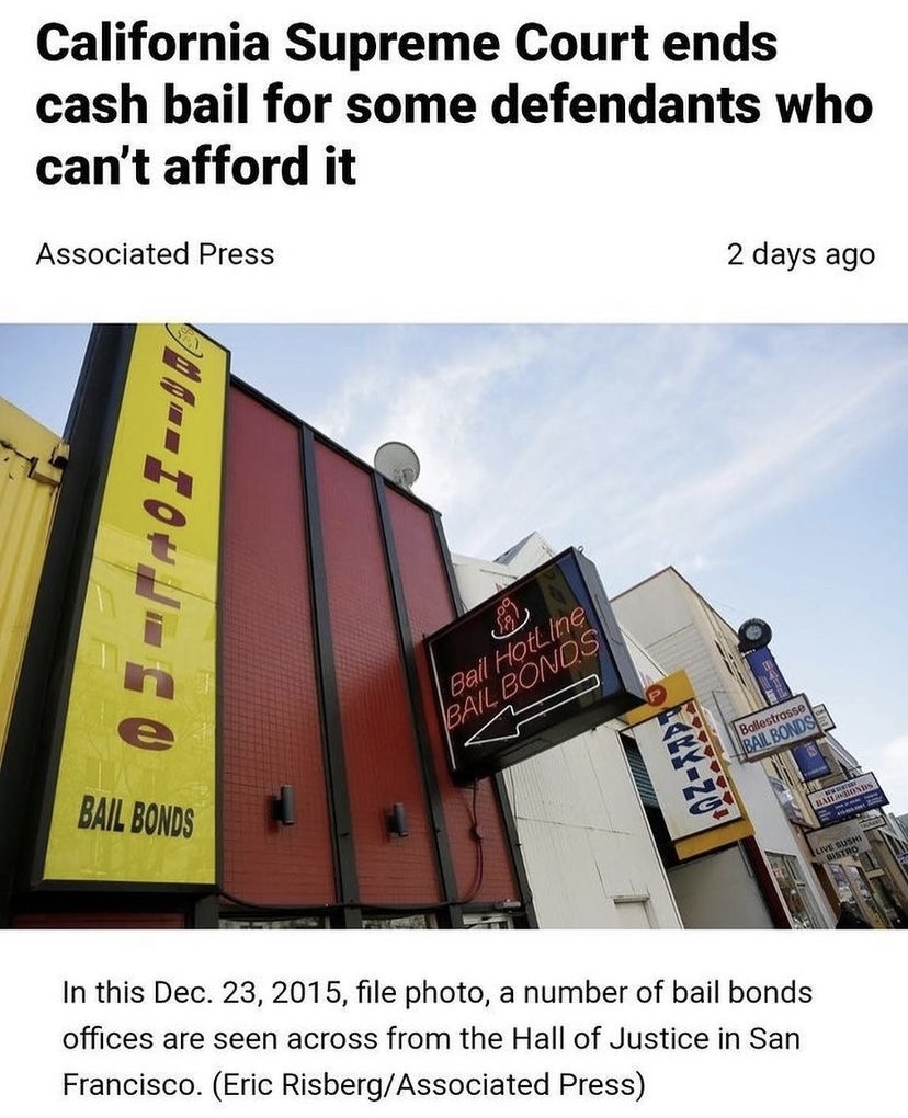 a store front with bail bond signs and a news headlne above that reads "California Supreme Court ends cash bail for some defendants who can’t afford it"