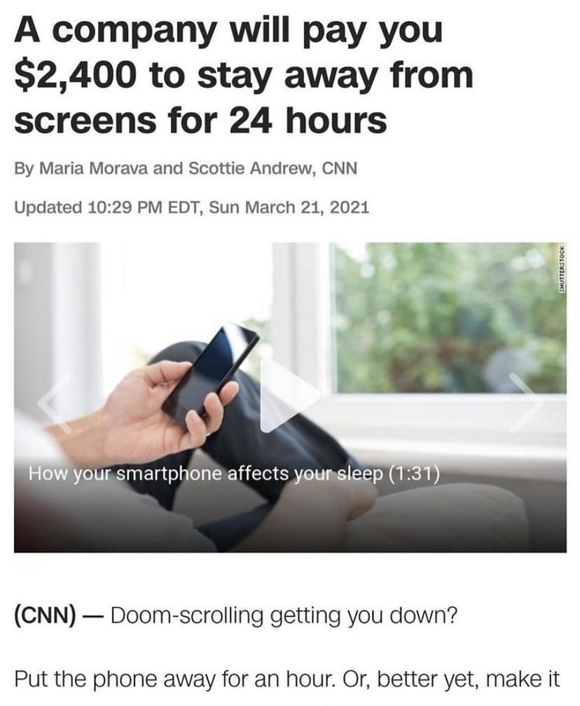 a person's hand holding a smart phone