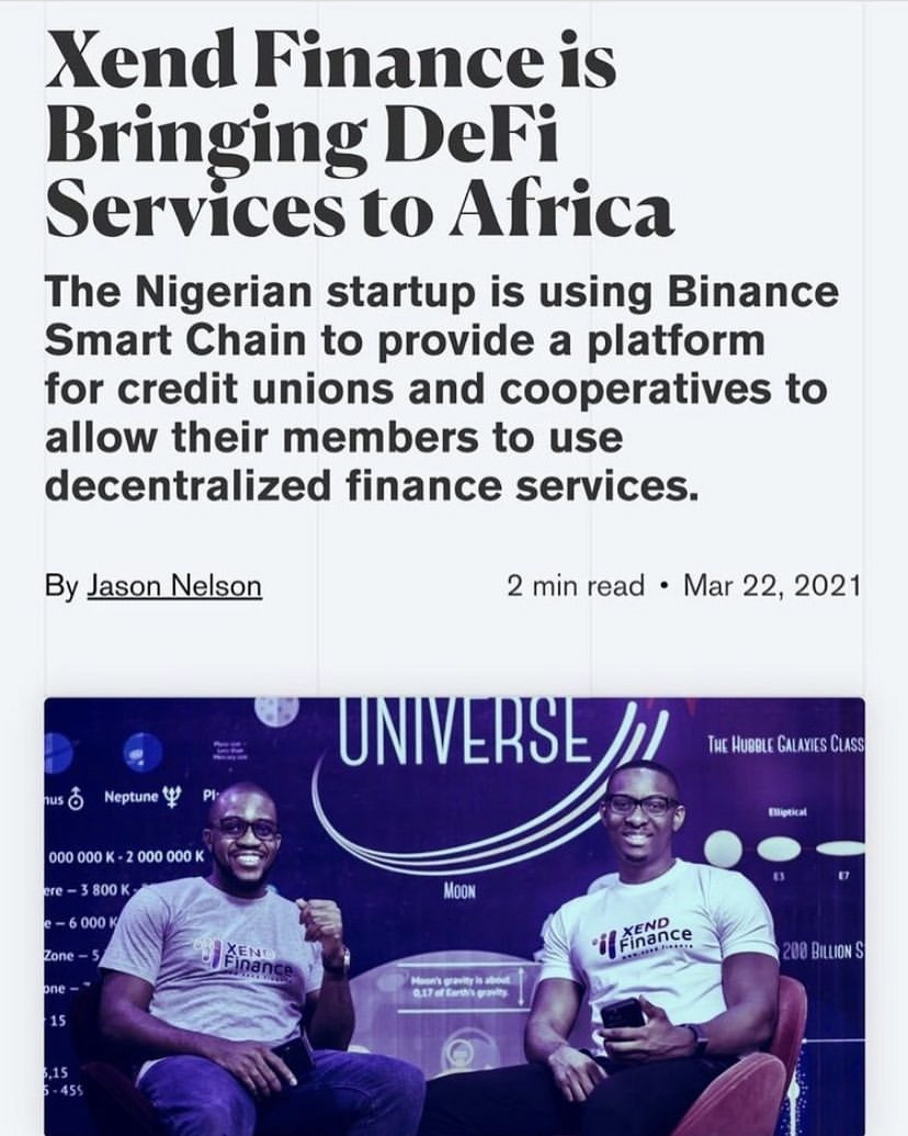 two men sitting on stage at a tech conference