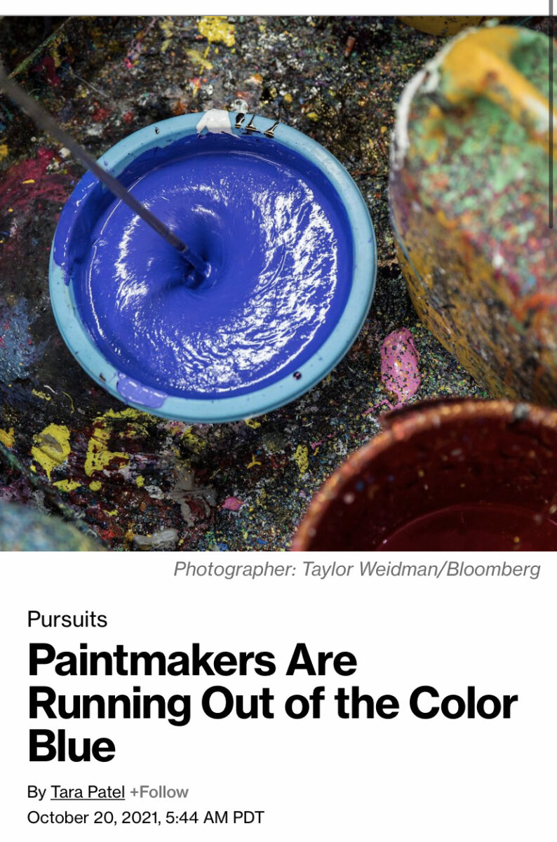 Bucket of blue paint being filled above a headline that reads "Paintmakers Are Running Out of the Color Blue"