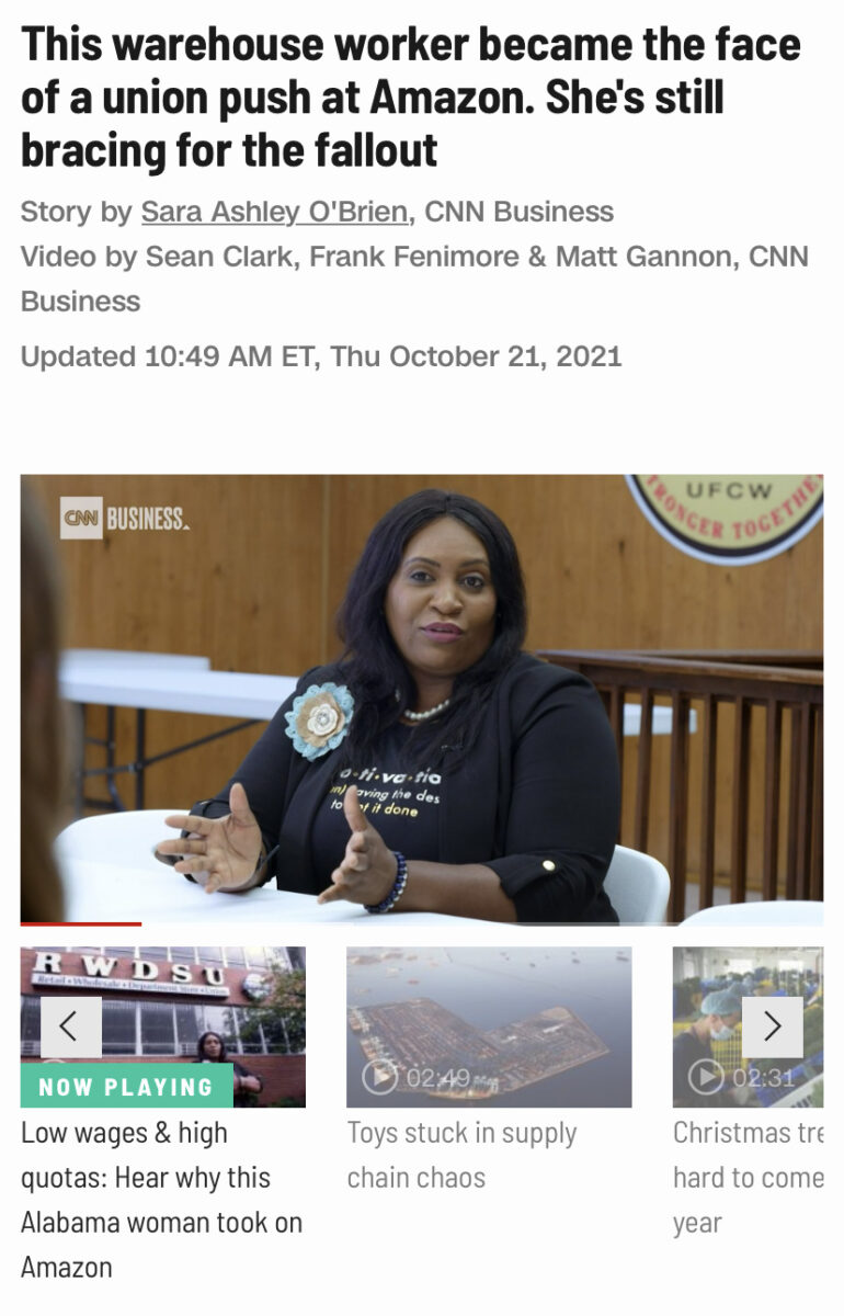 Woman with a blue ribbon on her blazer sitting in a wood clad room with a union badge on the wall beneath a headline that reads "This Warehouse Worker Became the Face of a Union Push at Amazon. She’s Still Bracing for the Fallout"