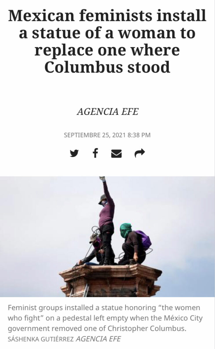 Two people on top of a statue pedestal one raising their fist in the air below a news headline that reads "Mexican feminists install a statue of a woman to replace one where Columbus stood"