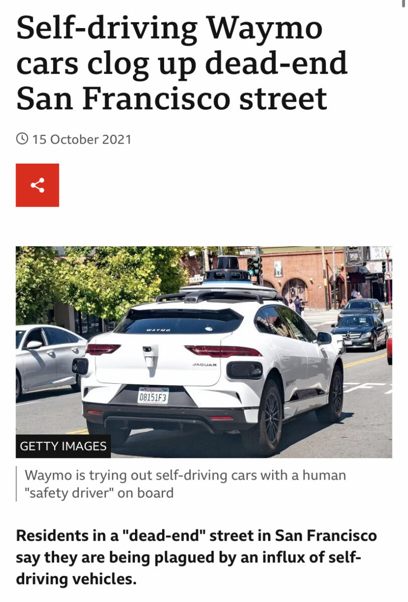 Self-driving car below a headline that reads "Self-driving Waymo cars clog up dead-end San Francisco street"