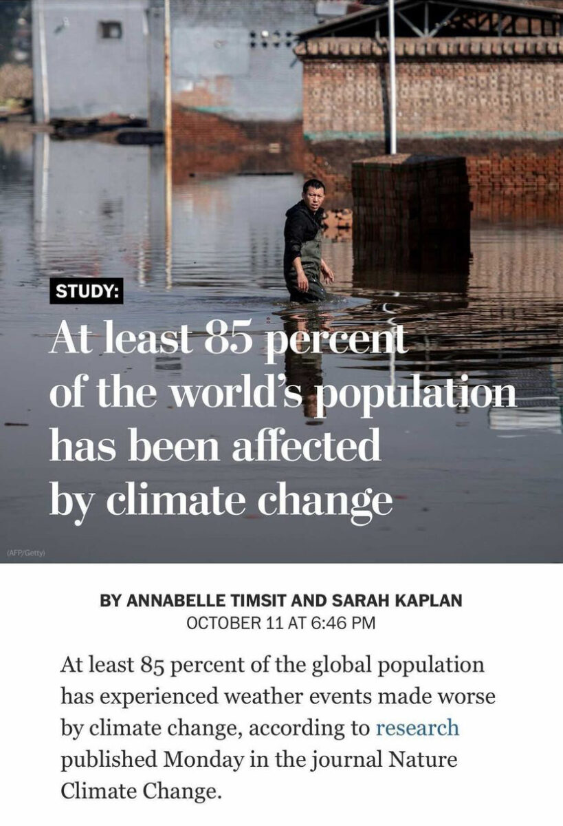 Man walking in flood water up to his waist behind a headline that reads "At least 85 percent of the world’s population has been affected by human-induced climate change, new study shows"