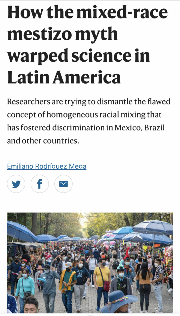 A big group of people walk along a boulevard under blue umbrellas beneath a headline that reads "How the mixed-race mestizo myth warped science in Latin America"