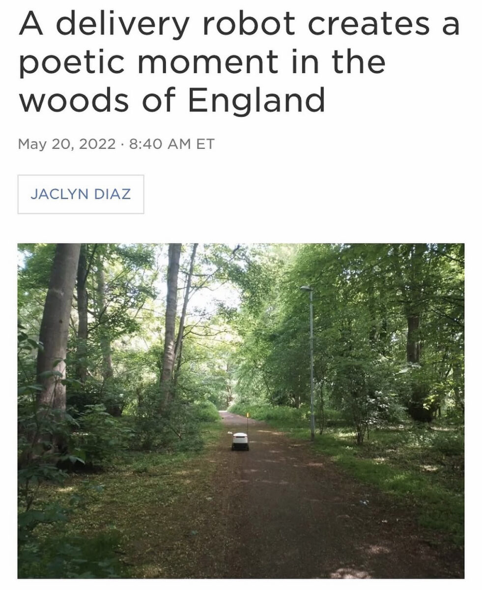 a delivery robot rolling through the forest on its own beneath a headline that reads "A delivery robot creates a poetic moment in the woods of England"