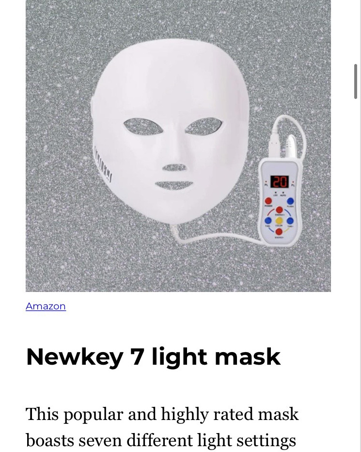 a white facemask attached to a remote control above text that reads "Newkey 7 light mask"