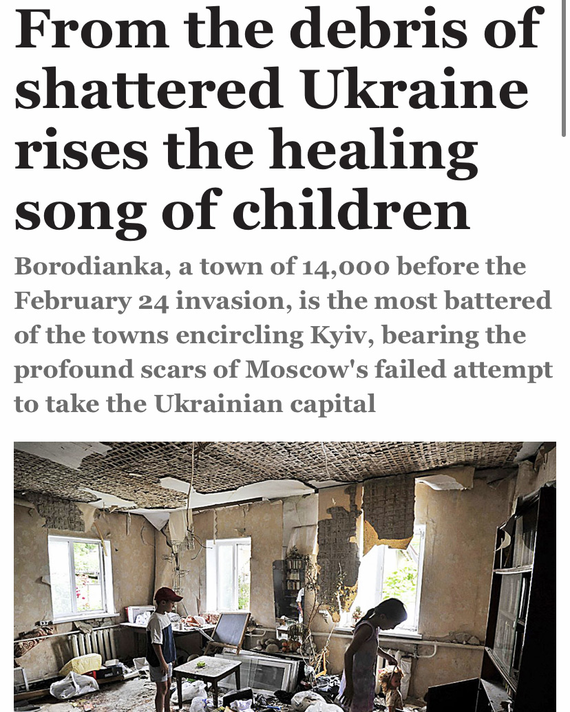 Children inspect a room damaged by the shelling in the town of Borodianka, near Kyiv beneath a headline that reads "From the debris of shattered Ukraine rises the healing song of children"