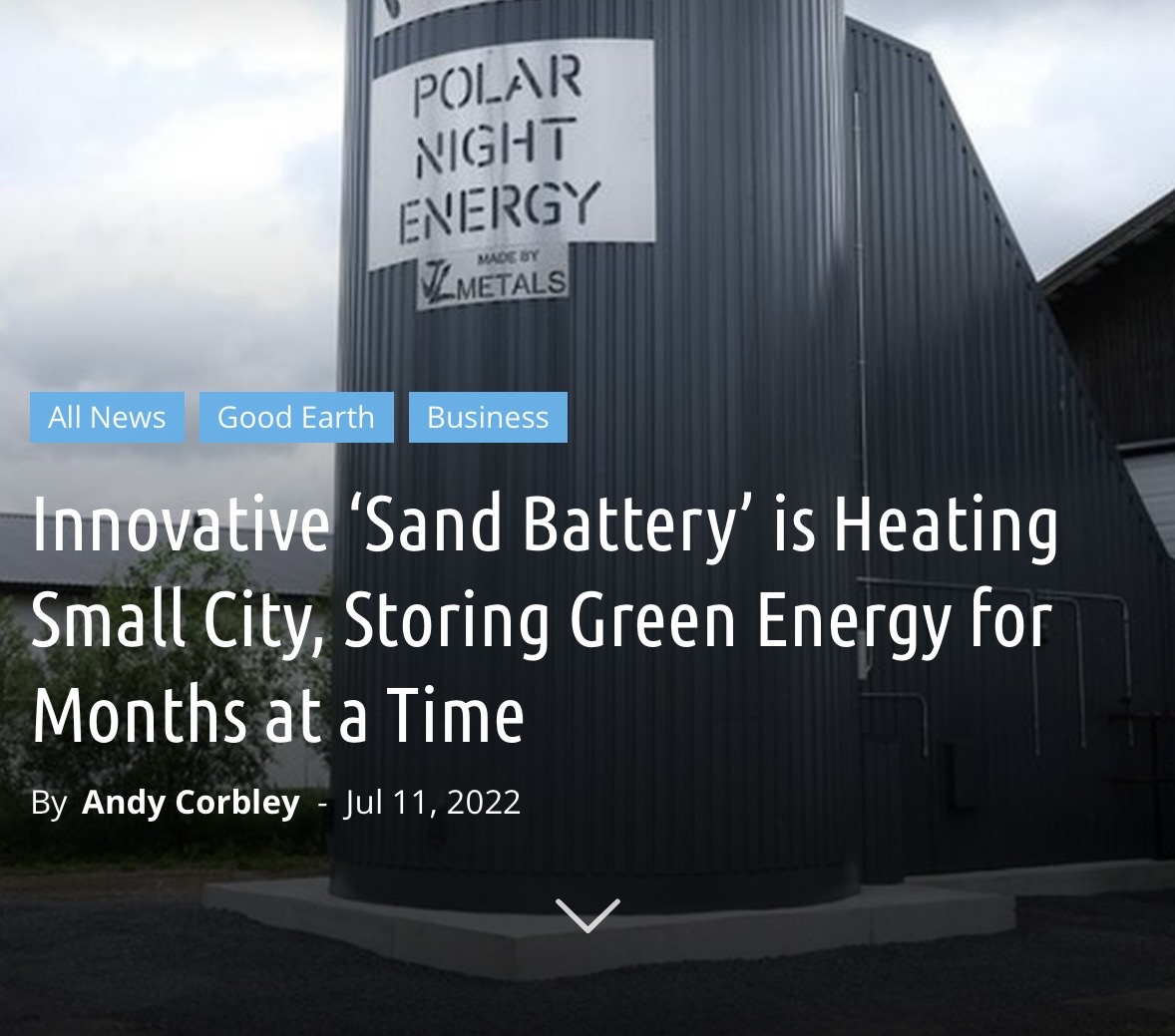 grey metal silo with a headline in front that reads "Innovative ‘Sand Battery’ is Heating Small City, Storing Green Energy for Months at a Time"
