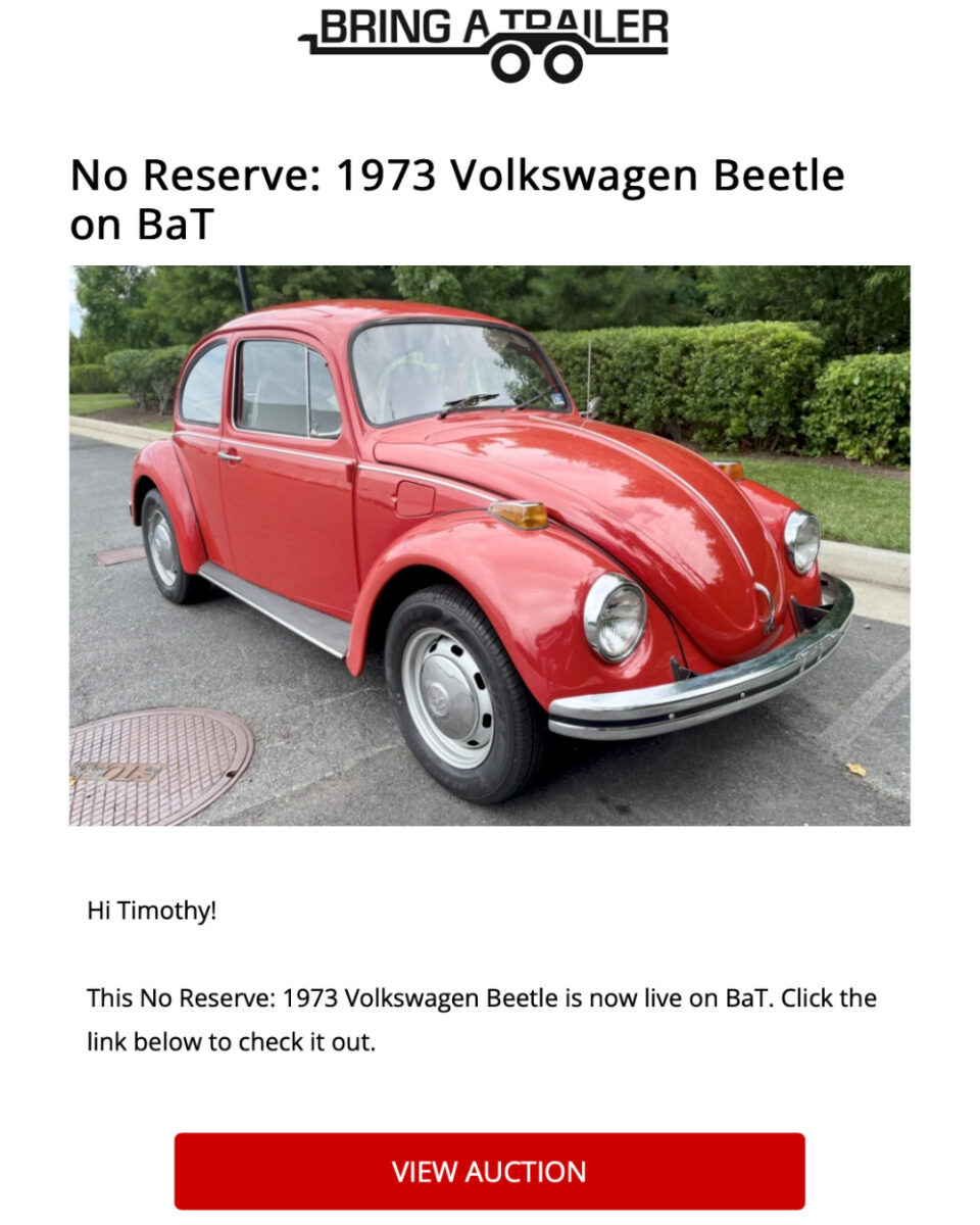 a red 1973 Volkswagen Beetle on an auction website page